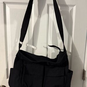 Black Messenger Bag with Fabric Texture and Adjustable Strap